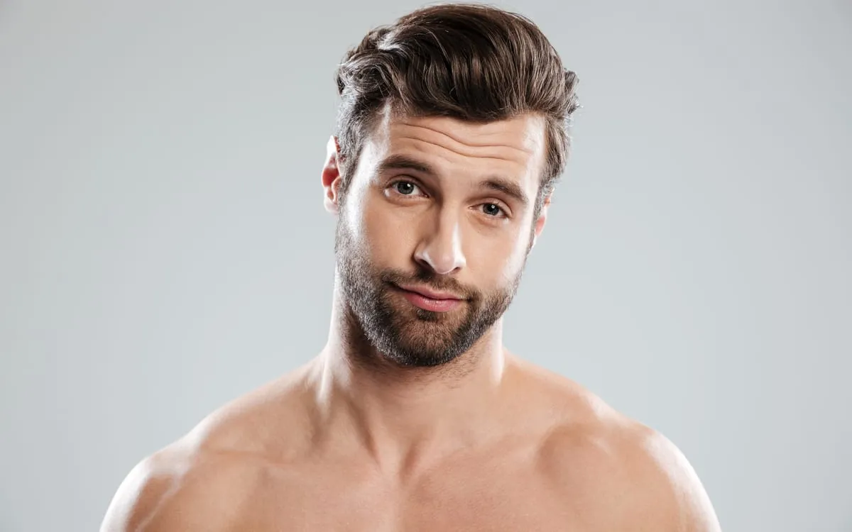 A man with a full head of hair after a hair transplant in Turkey